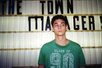 frick in front of sign