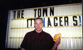 rick in front of sign